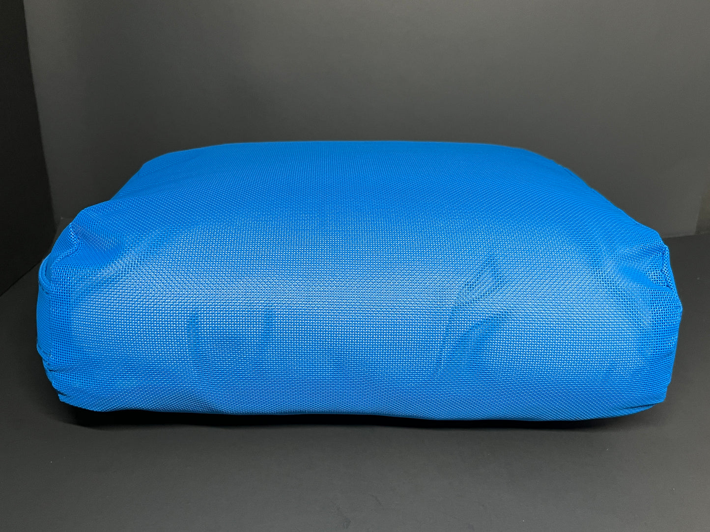 Side view of Water Brick (blue) spa booster seat.