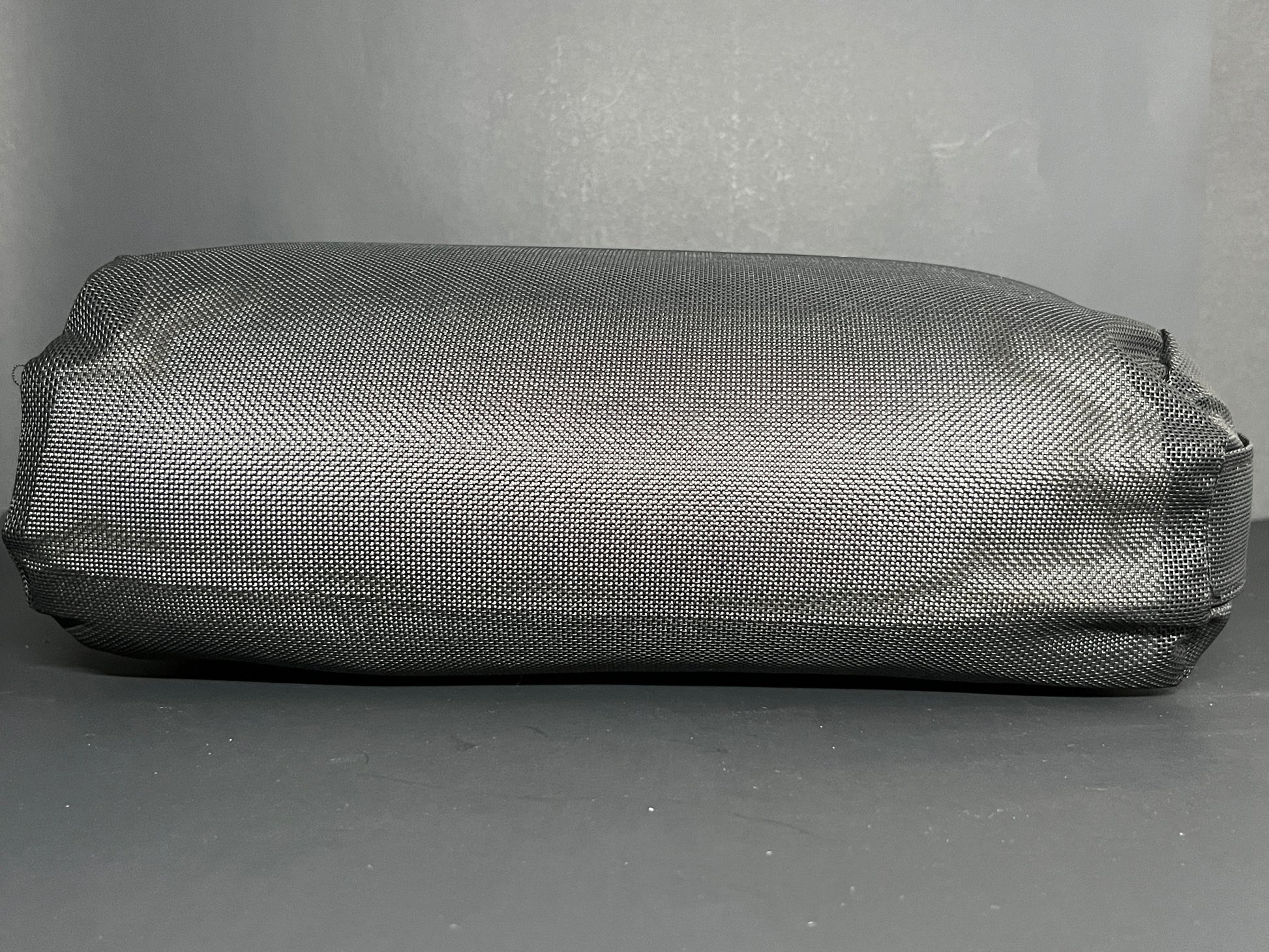 Side view of the Water Brick (black) spa booster seat.