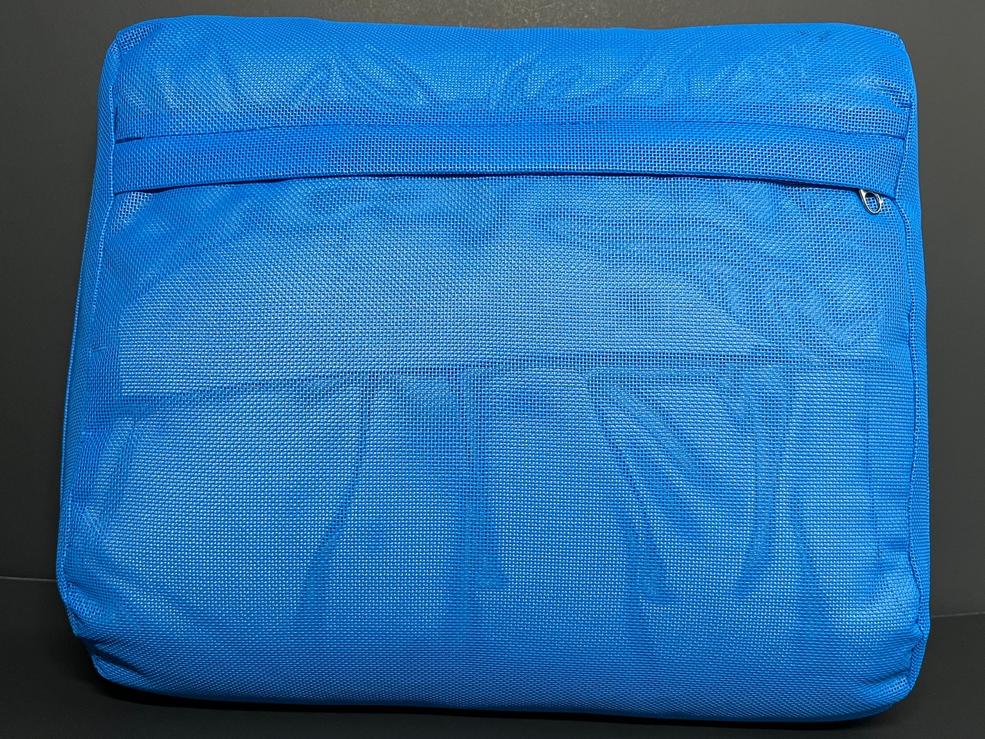 Bottom Side of Water Brick (blue) spa booster seat, showing the zipper access to the interior cushion.