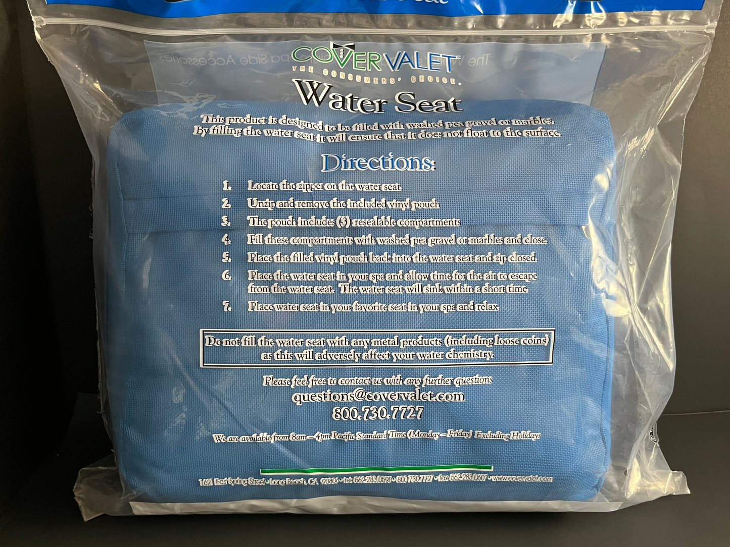 Back side of Water Brick (blue) spa booster seat in product packaging, displaying directions for use.