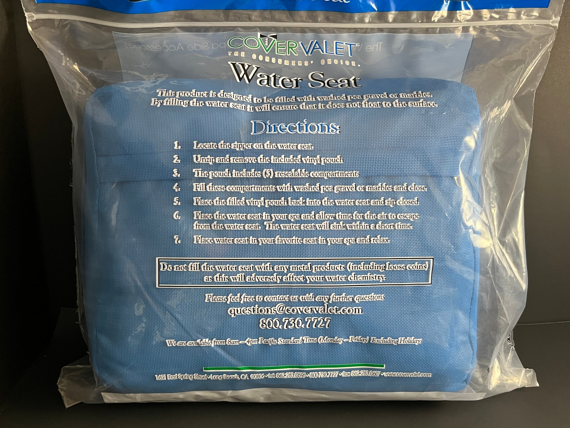 Back side of Water Brick (blue) spa booster seat in product packaging, displaying directions for use.
